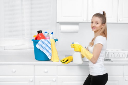 Office cleaning team sanitising desks and shared areas in a Ruislip business