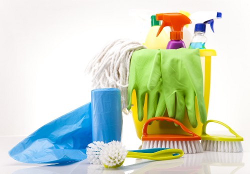 Professional carpet cleaners restoring a living room carpet in Ruislip